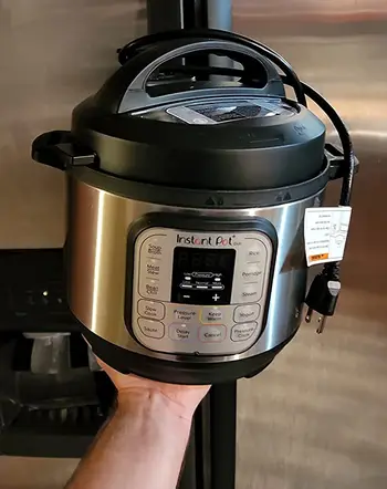 reviewer holding insta pot